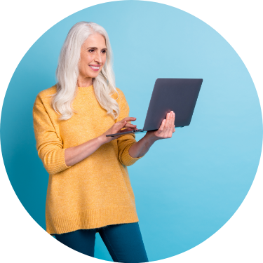 Grey Haired Female Standing with Laptop Cyan Background