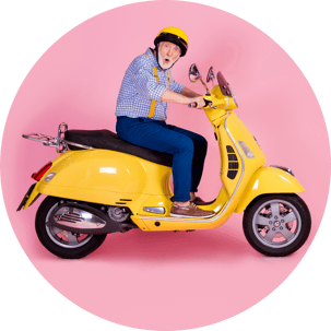 Retired Male on Yellow Scooter Pink Background-1