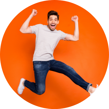 Young Male Excited Jumping Orange Background